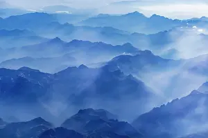 Peaks: Mountains and clouds, mountain peaks in blue light