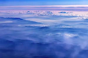 Peaks: Mountains and clouds, mountain peaks in blue light