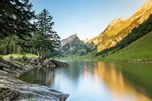 Alpstein: Mountains reflected at sunrise in Lake Seealpsee