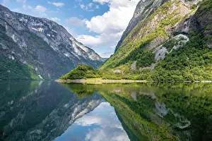 Narrows: Mountains reflected in the water, Naeroyfjord, Aurland