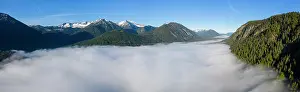 Protrude: Mountains rising out of high fog over Lake Sylvensteinsee