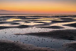 Tideland: Mudflats in the evening light, beach at low tide