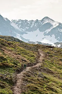 Hiker: Muottas Muragl, Switzerland. Hiking atop