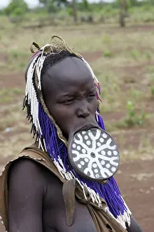 Disk: Mursi people - man with lip plate / plug / disk