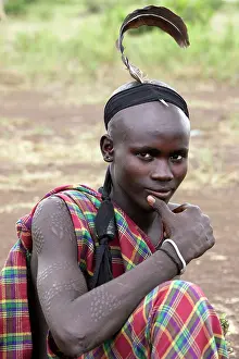 Tradtional: Mursi people - man with ostrich feather