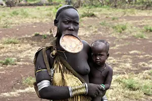 Disk: Mursi people - woman with lip plate / plug / disk