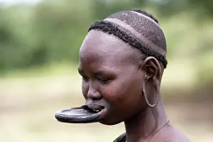 Disk: Mursi people - woman with lip plate / plug / disk