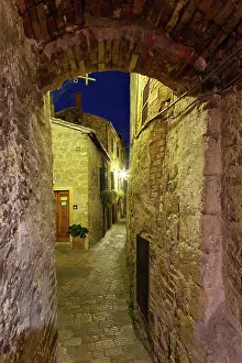 Opening: Narrow walkway through arched opening at