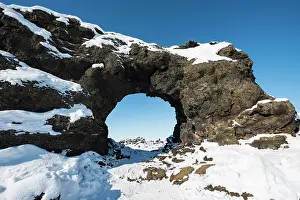 Myvatni: Natural arch, view of a snowy landscape, lava field