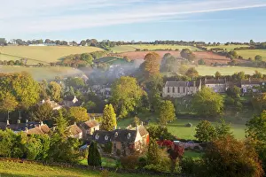 Cotswolds: Naunton village and morning mist, Naunton, Gloucestershire