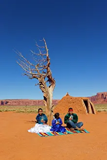 Indians: Navajo Indian - in traditional clothes in front of a Hogan