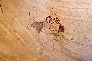 Riding: Neolithic rock painting, cow with load and rider