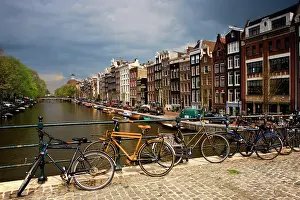 Bicycle: Netherlands, Amsterdam. View of canal from