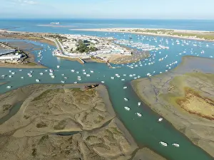 Boats: Network of channels and streams at low tide and the fishing village of Sancti Petri at the Atlantic Ocean