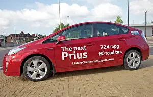 Emissions: New Prius T3 hybrid red motor car fuel consumption