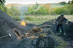 Charcoal: Newly-lit pile in the traditional charcoal-burner's
