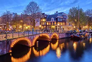 Canal: Night view of Amterdam cityscape with canal, bridge