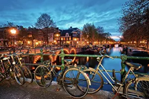 Canal: Night view of Amterdam cityscape with canal, bridge