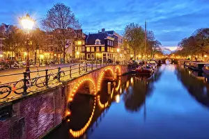 Canal: Night view of Amterdam cityscape with canal, bridge