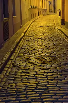 Latvia: Night view of cobblestone street in the old town
