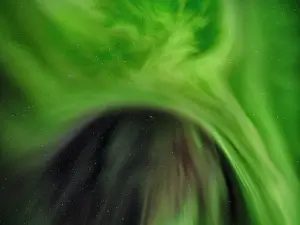 Strait: Northern lights over Angmagssalik Fjord near settlement