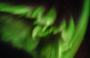 Strait: Northern lights over Angmagssalik Fjord near settlement