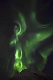 Forecast: Northern Lights (Aurora borealis) behind mountain
