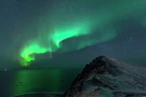Vesteralen: Northern Lights / Aurora Borealis with mountains and sea