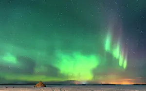 Sami: Northern Lights / Aurora borealis with traditional