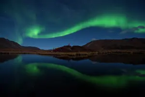 Peter Mather: Northern Lights reflected in lake at night Yukon, Canada