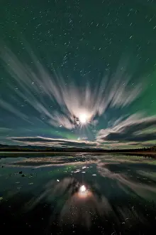 Peter Mather: Northern Lights reflected in lake at night Yukon, Canada