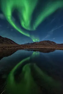 Peter Mather: Northern Lights reflected in lake at night Yukon, Canada