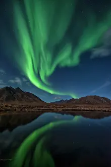 Peter Mather: Northern Lights reflected in lake at night Yukon, Canada
