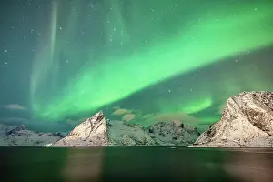 Situation: Northern Lights over Snowy Bergen, Reinefjord, Moskenesoya