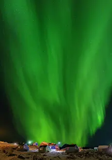 Settlement: Northern Lights over the town. Town Tasiilaq (formerly
