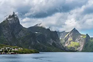 Lofoten: Norway, Hamnoy. Fishing village houses and mountains. ic Don