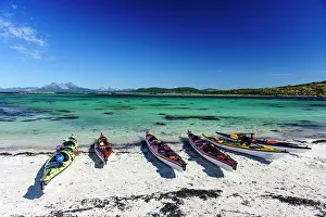 Kayaks: Norway. Sea kayaks on a coral-sand beach