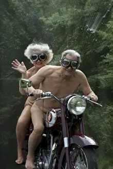 Motorcycle: NUDE older couple on an old motorbike