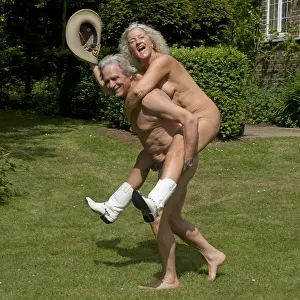 Backs: NUDE older couple, piggy back with cowgirl hat &