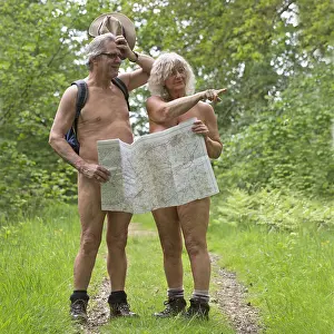 Older: NUDE. older couple walking in the countryside