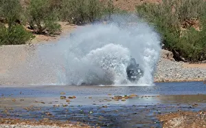 Cars: Off-road vehicle crosses a river in the Middle Atlas