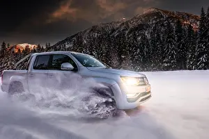 Drives: Off-road vehicle drives through snow at dusk, Ammer