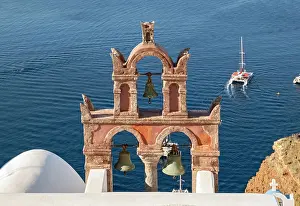 Christianity: Old belfry wiith yacht and blue sea, Ia, Oia, Sa