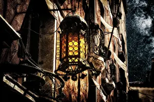 Dangerous: Old-fashioned lantern on the wall of a house. My