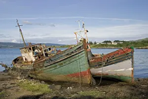 Wrecks: Old fishing boats rotting on beach, Isle of Mull