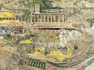 Mining: Old mining site and deep orange-red hues in the water of a pool in the mineral-rich area of the Rio Tinto mines