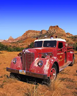 Lorry: Old-style red fire engine parked on scrubland at