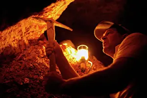 Pick: Opal mining miner using pick to find opal traces