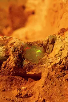 Gemstones: Opal mining opal in mine wall Coober Pedy