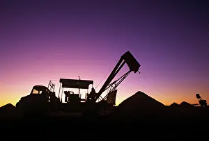 Machines: Opal mining silhouette of mining operation with